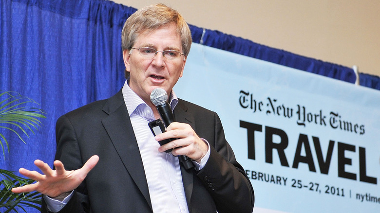 Rick Steves speaking at a travel show