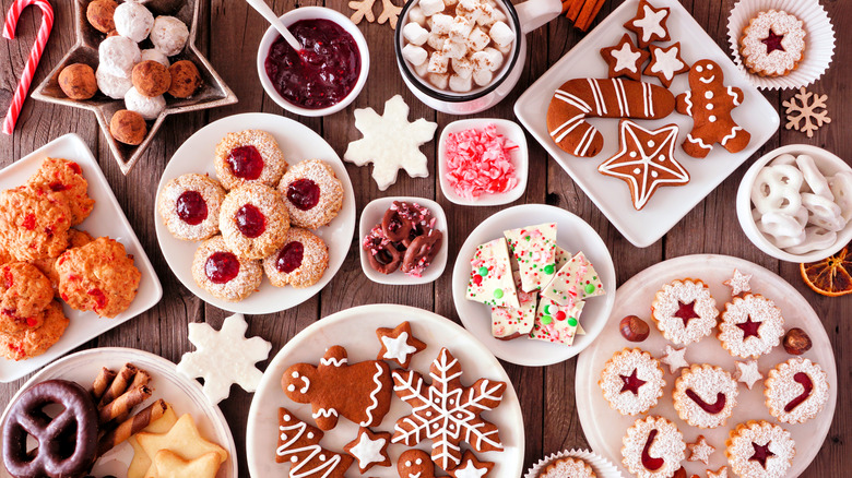 Top-down view of a spread of winter holiday cookies and other snacks