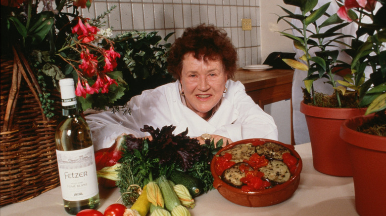 Julia Child posing with food