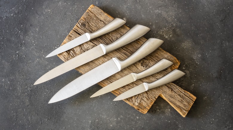 Kitchen knives on wood board