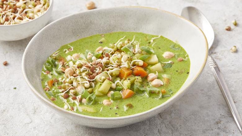 vegetable and pesto soup in a bowl