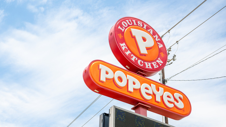 Tall exterior sign for a Popeyes Louisiana Kitchen in Austin, TX