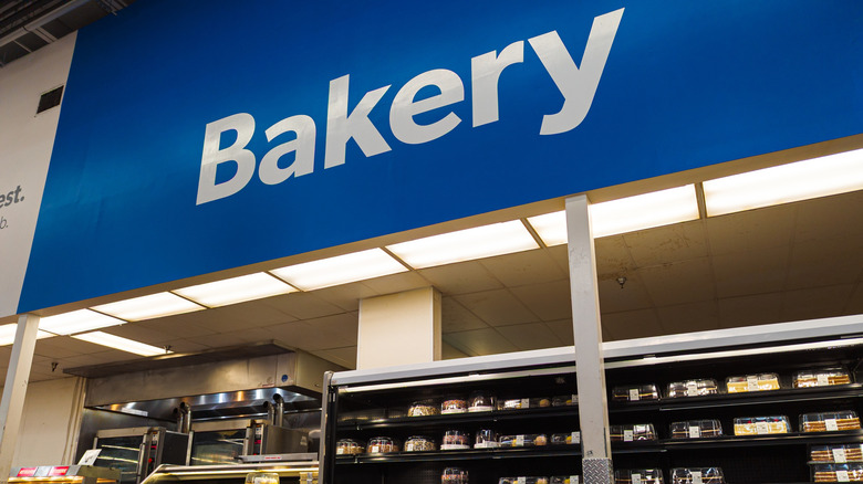 Walmart bakery counter with a cooler full of cakes