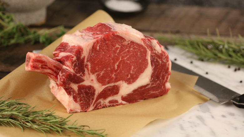 Cowboy steak on cutting board