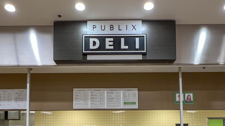 A wall-mounted sign for the Publix Deli