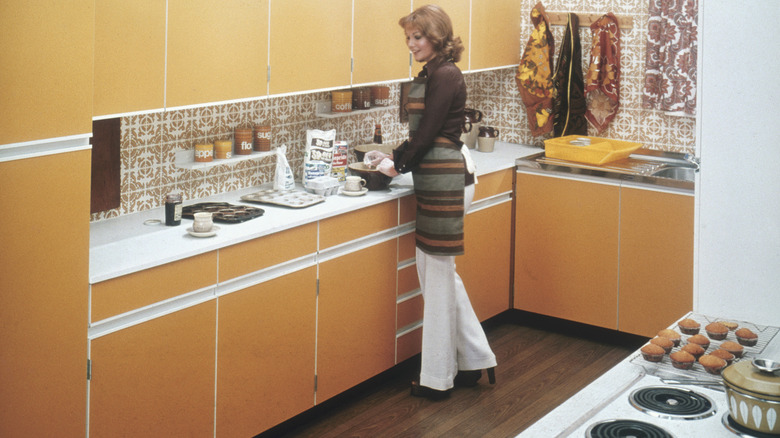 Woman in a 1970s kitchen
