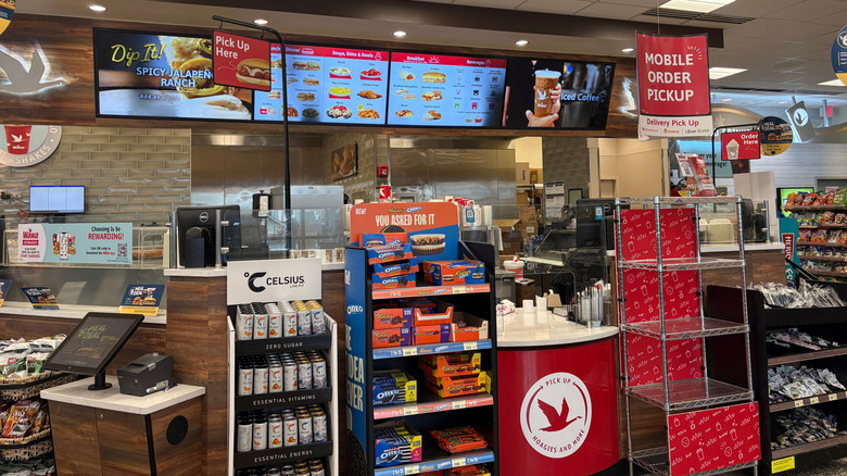 Interior view of Wawa counter with the menu behind it