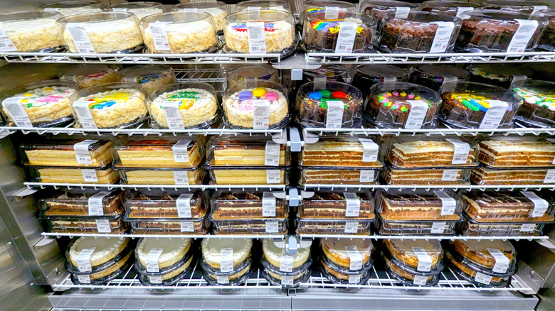Cakes at a on shelves at a grocery store